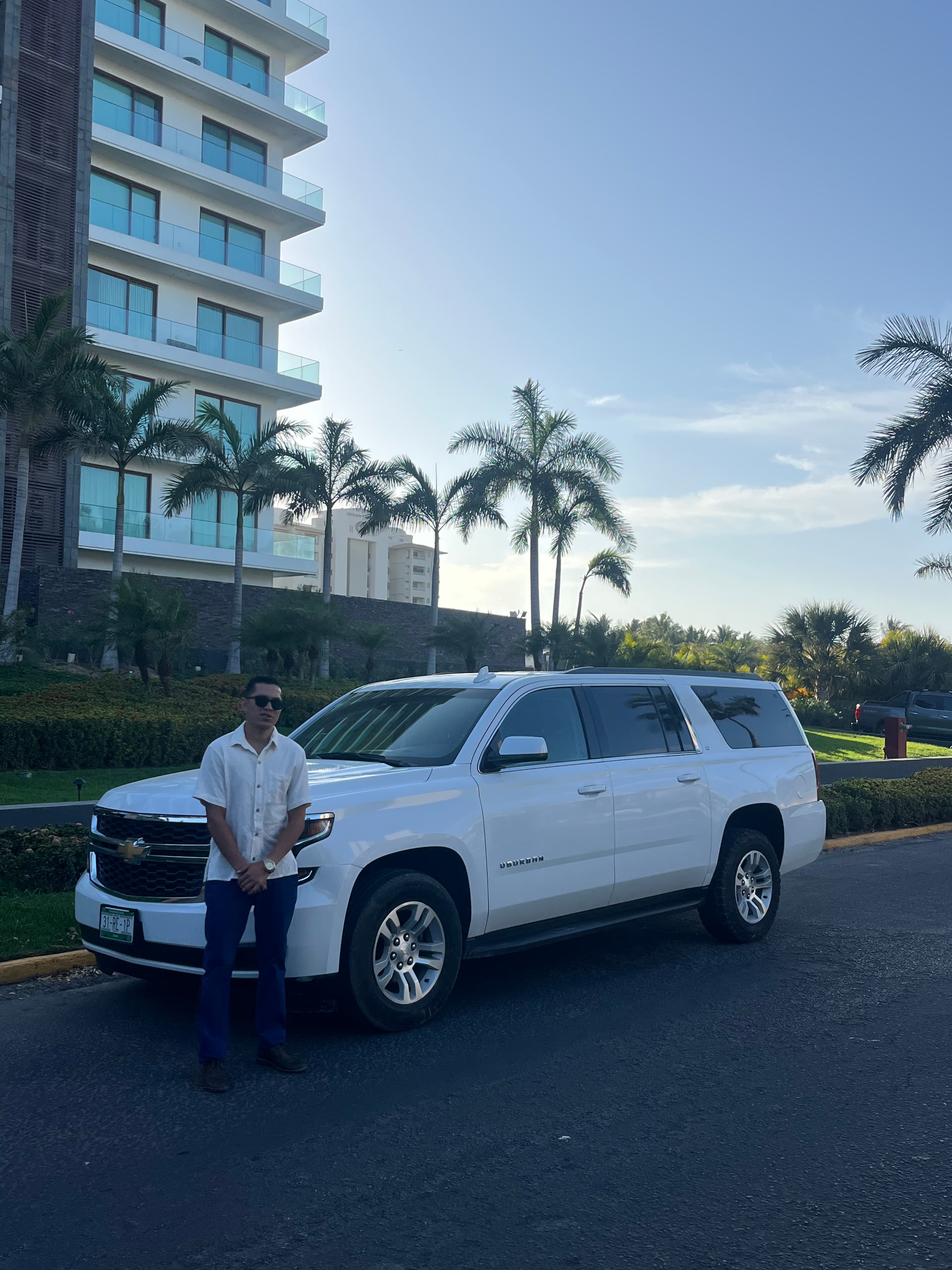 Carlitos with the Suburban at a luxury resort